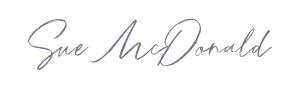 Sue Mcdonald purple script signature.